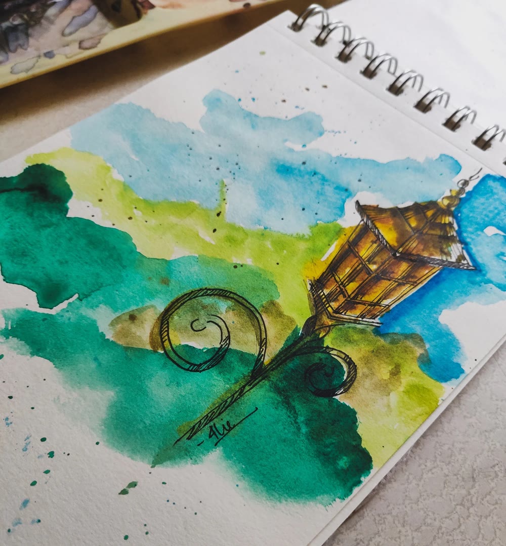 Ink and watercolor illustration by Charlie Jain — an ornate street lamp
