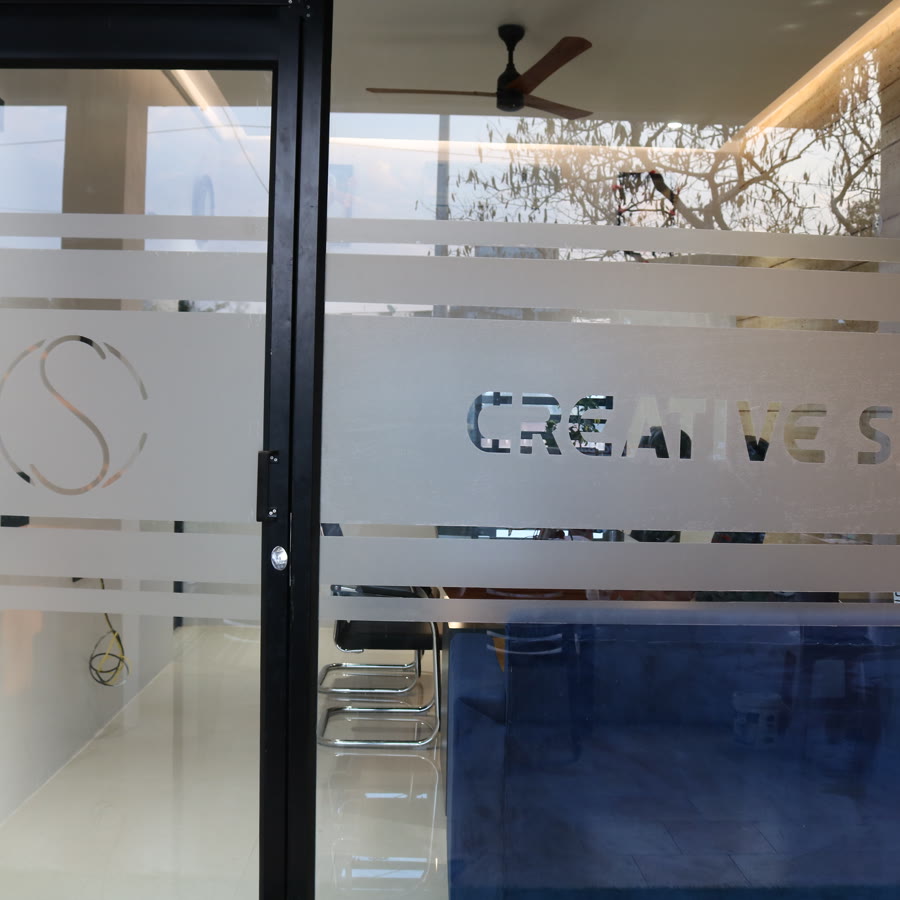 Creative Spaces studio entrance — branded glass door