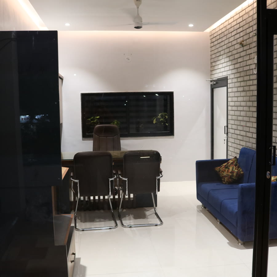 Creative Spaces studio interior — meeting table and lounge seating